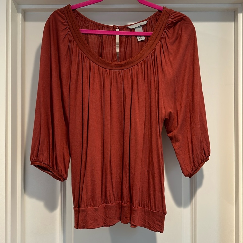 Rust colored peasant style blouse.